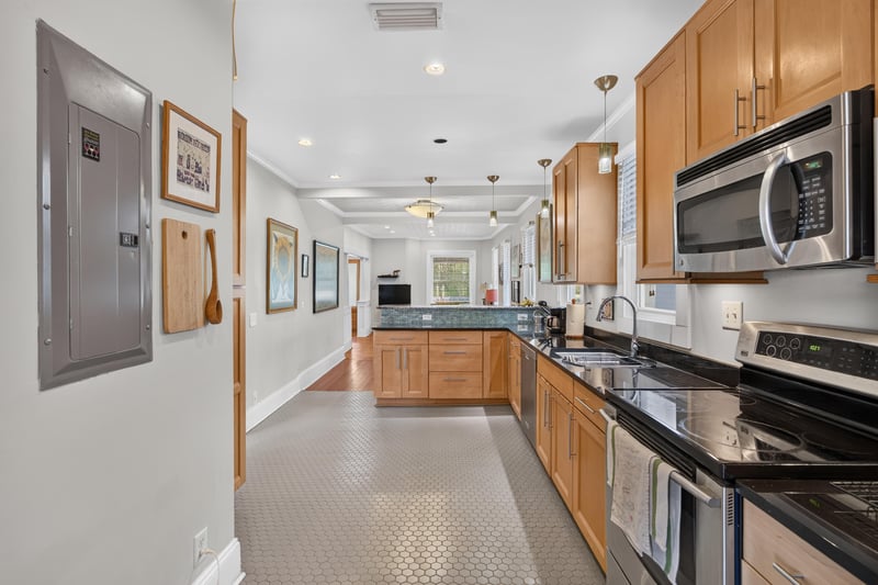 Kitchen sink area with wood cabinetry at 1555 Belmonte Ave, Jacksonville, FL 32207