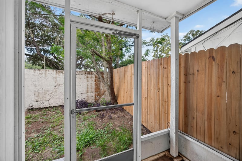 Screened porch with wood fence view at 2658 Trollie Ln apt 1, Jacksonville, FL 32211