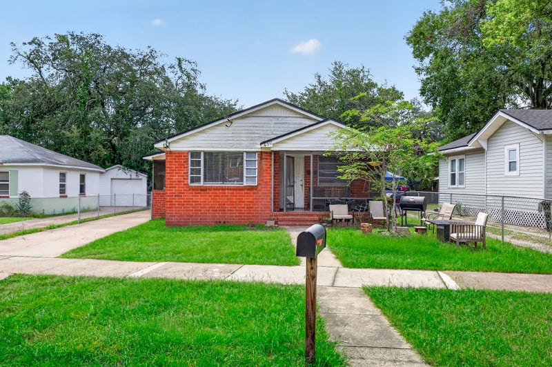 Front exterior of brick ranch home with grass lawn at 450 E 46th St, Jacksonville, FL 32208