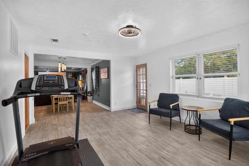 Flex room with treadmill opening to adjoining room at 6059 Karen St, Jacksonville, FL 32244
