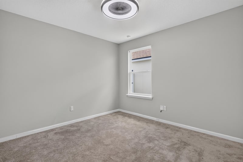Bedroom with carpet flooring and ceiling fan at 10066 Andean Fox Dr, Jacksonville, FL 32222