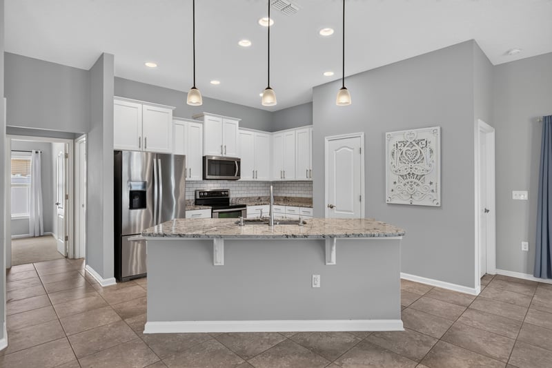 Kitchen island with stainless appliances at 85 Amia Dr, St. Augustine, FL 32086