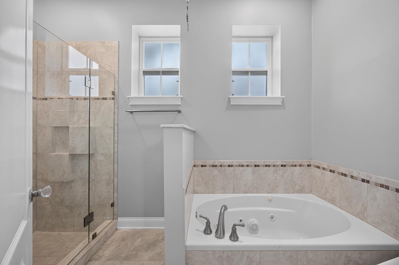 Bathroom with soaking tub at 117 Island Cottage Way, St. Augustine, FL 32080
