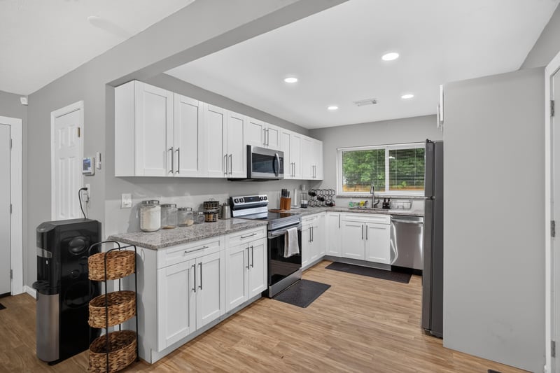 Kitchen with stainless range and refrigerator at 9506 Harriet Ave, Jacksonville, FL 32208