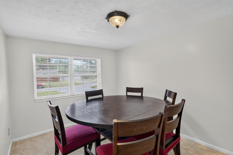 Dining area with round table and chairs at 9954 Larkdale Ct, Jacksonville, FL 32257