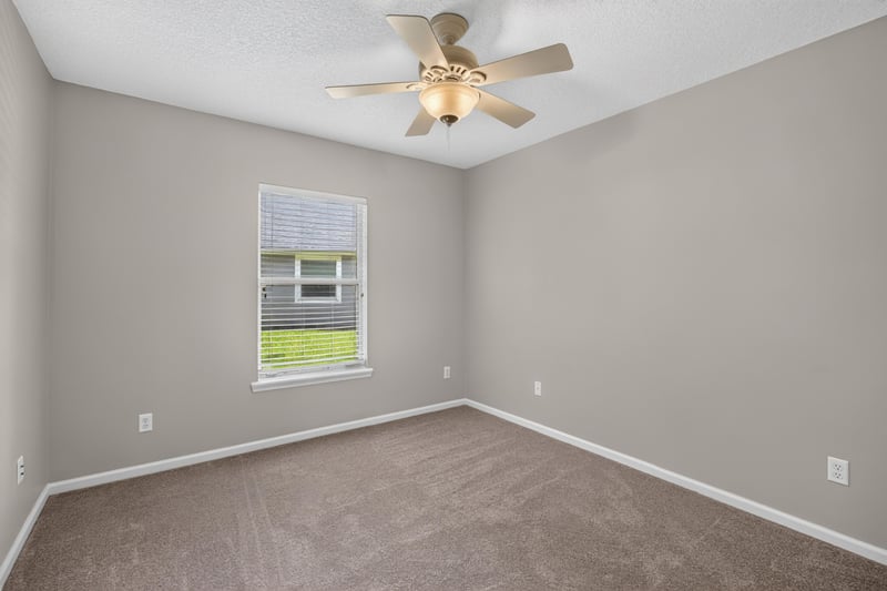 Empty bedroom with carpet and window at 1955 GUARDED Way, Fleming Island, FL 32003