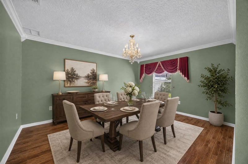 Virtually staged dining room with green walls at 2282 Justin Lake Dr, Jacksonville, FL