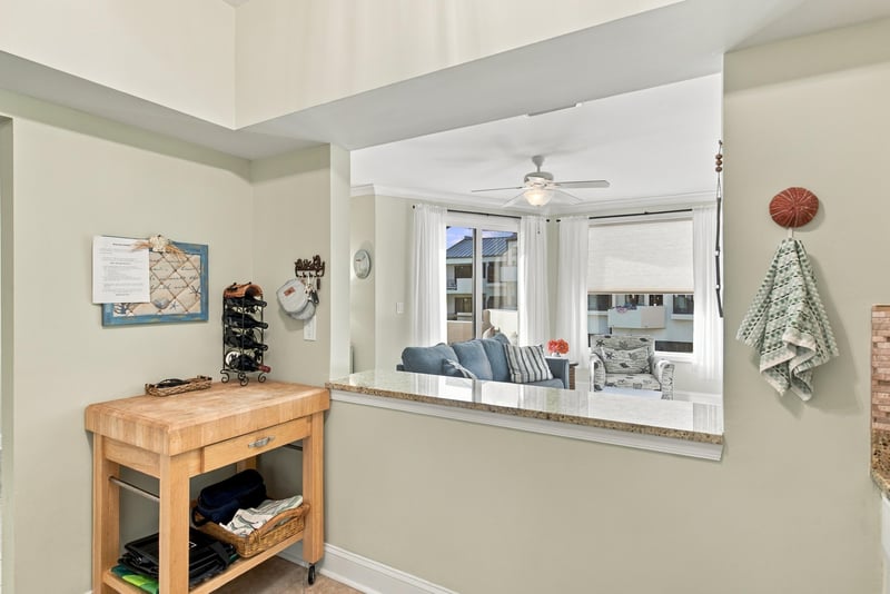Kitchen pass-through open to living room at 805 Spinnakers Reach Dr, Ponte Vedra Beach, FL 32082