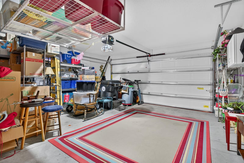 Garage interior with storage shelving at 4319 Green River Pl, Middleburg, FL 32068