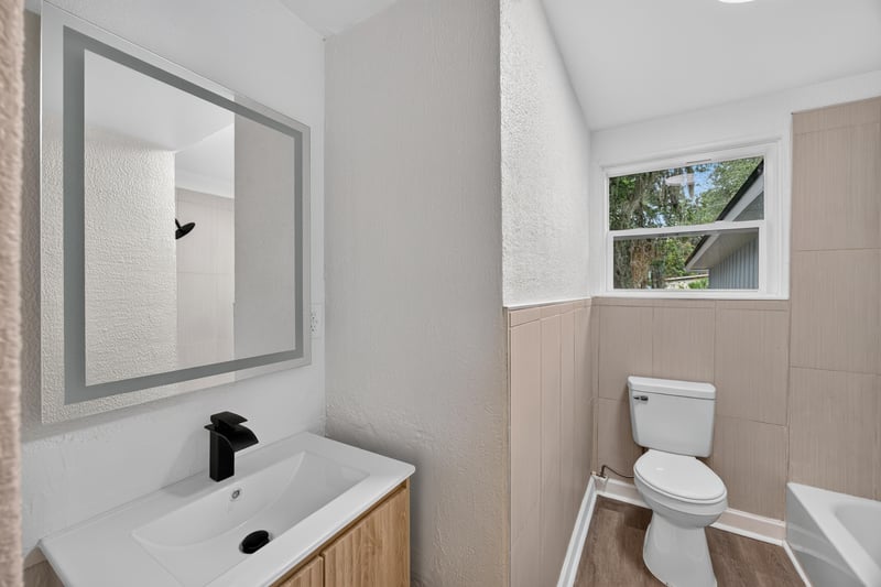 Bathroom with vanity, mirror and toilet at 3113 Kline Rd, Jacksonville, FL 32246