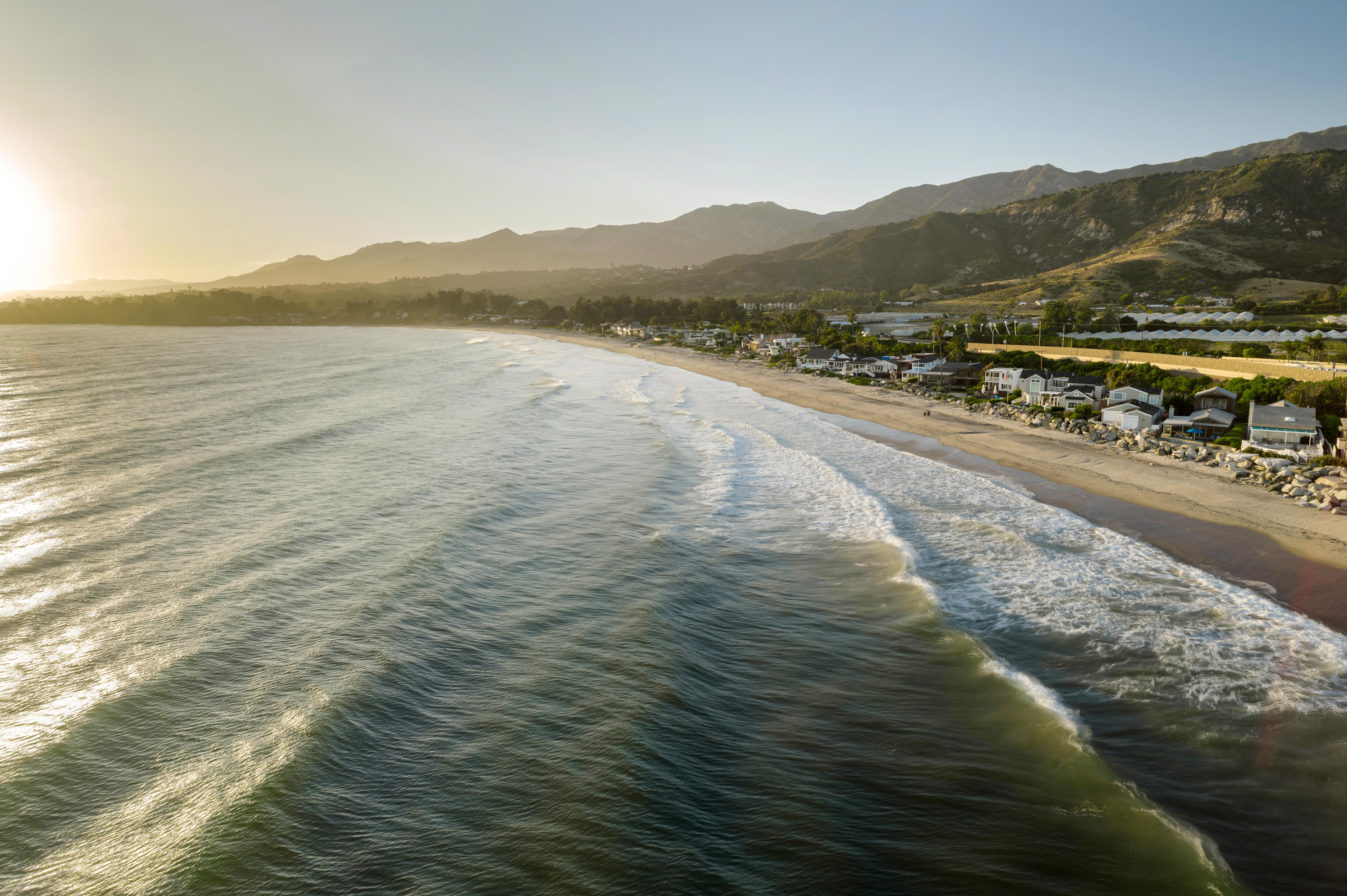 Aerial drone photography of 3581 Padaro Ln, Carpinteria CA — sweeping Southern California coastline and Santa Ynez Mountains backdrop by VirTour Media