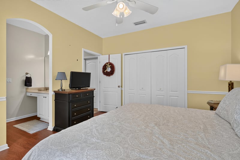 Bedroom with yellow walls and closet at 2304 Spring Hill Ct, Orange Park, FL