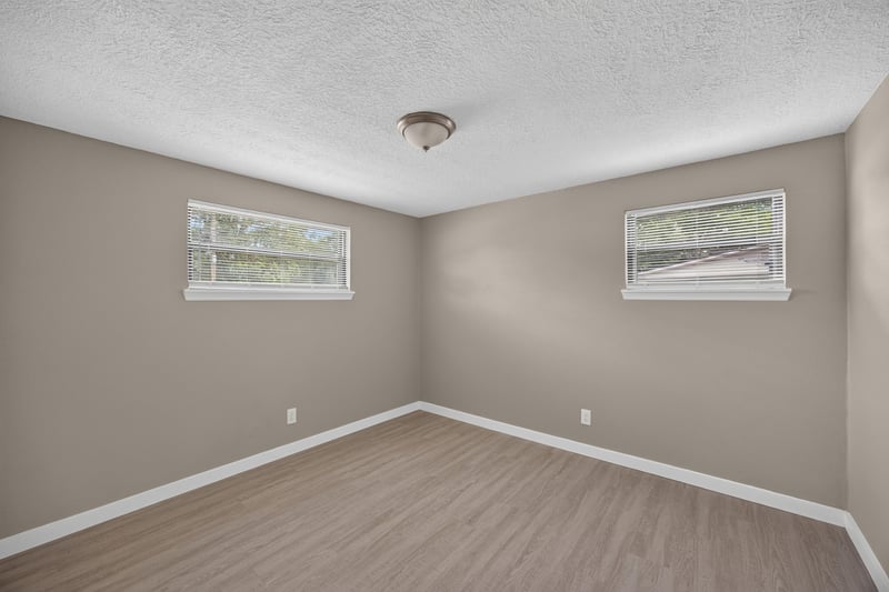 Empty bedroom with two windows at 184 Draco St, Orange Park, FL 32073