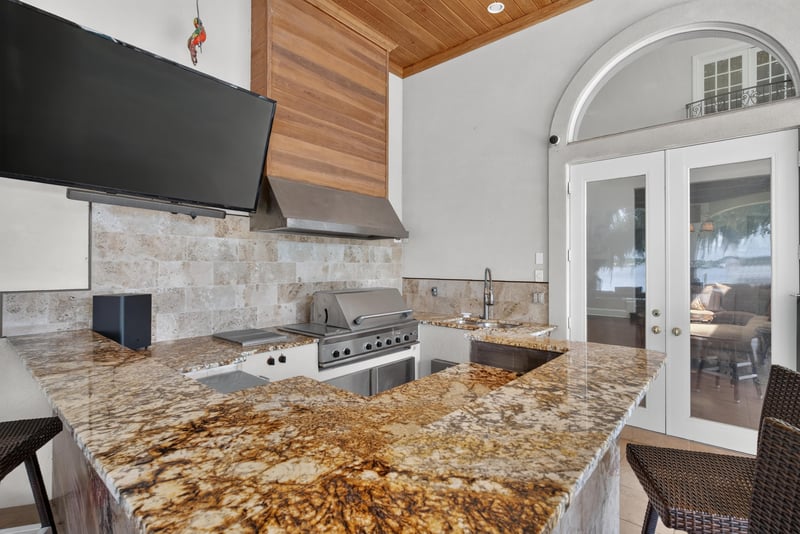 Outdoor kitchen with granite counter and grill at 344 Broward Rd, Jacksonville, FL