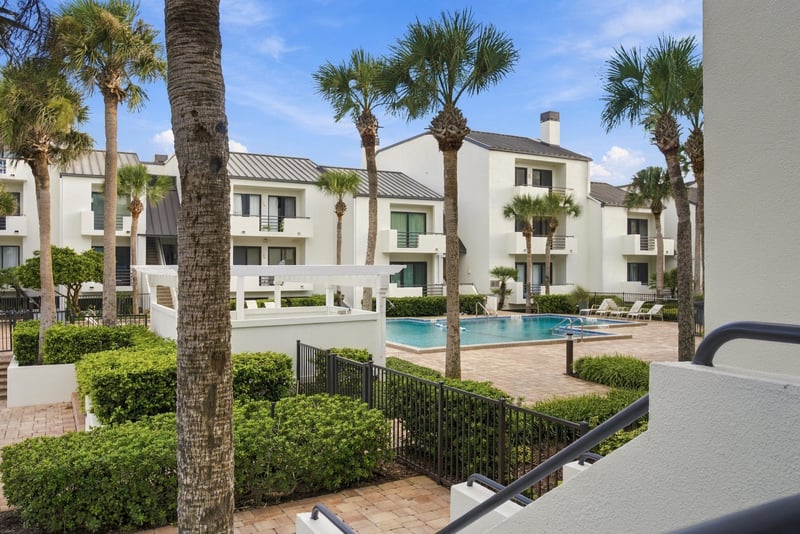 Balcony view of pool and grounds at 805 Spinnakers Reach Dr, Ponte Vedra Beach, FL 32082