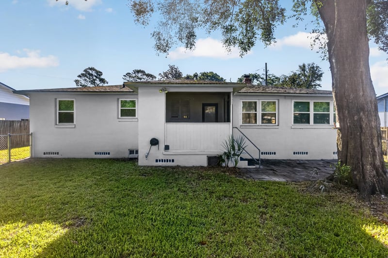 Rear exterior with screened porch at 6338 Mercer Cir W, Jacksonville, FL