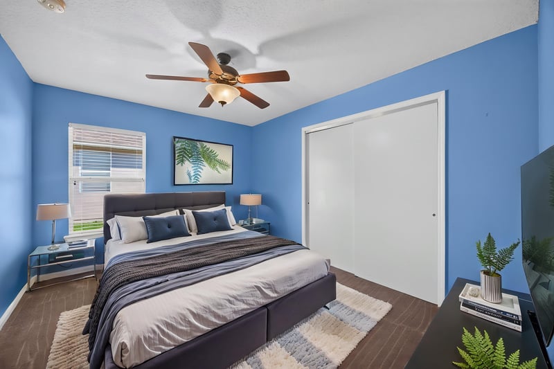 Virtually staged bedroom with closet and window at 2282 Justin Lake Dr, Jacksonville, FL