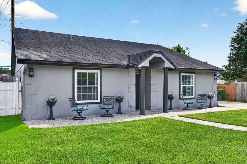 Front exterior close-up of entry and windows at 6931 Cane Grass Ln E, Jacksonville, FL 32244