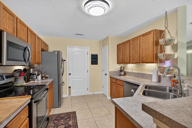 Kitchen with overhead pot rack at 1589 Backwater Drive, Middleburg, FL 32068