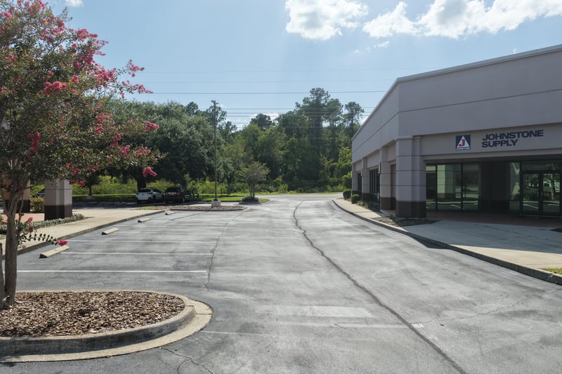 Parking lot with trees along the drive at 10550 Deerwood Park Blvd, Jacksonville, FL 32256