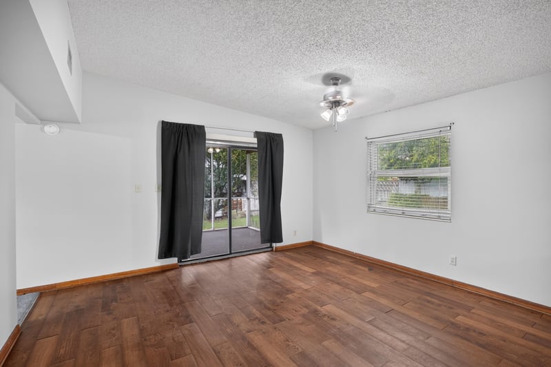 Dining area with wood floor and sliding glass door at 11462 Elane Dr, Jacksonville, FL