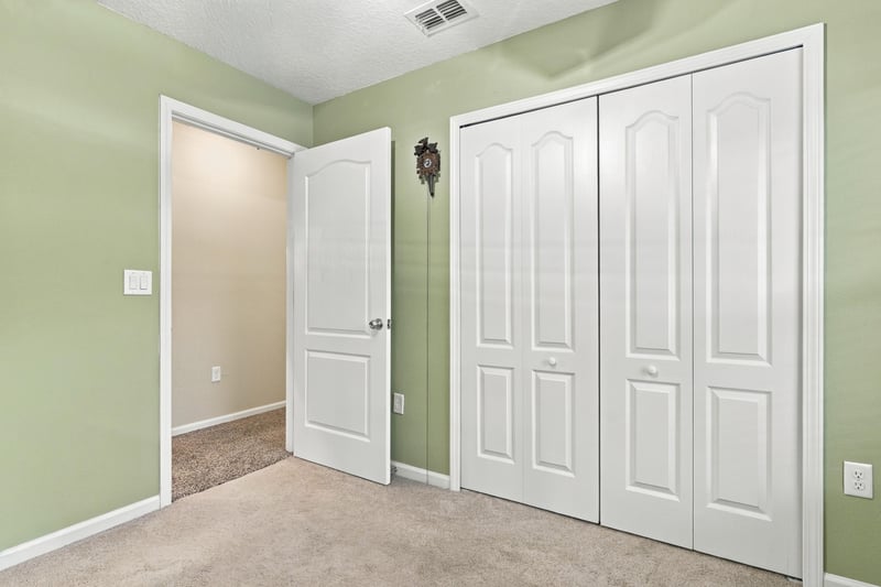 Hallway with closet doors at 10923 Black Diamond Ct, Jacksonville, FL