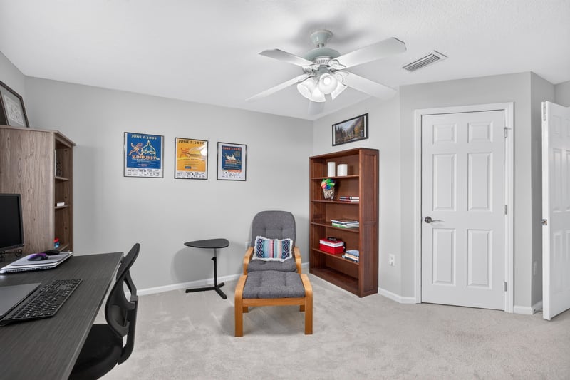 Home office corner with desk and chair at 11225 Water Spring Cir, Jacksonville, FL 32256