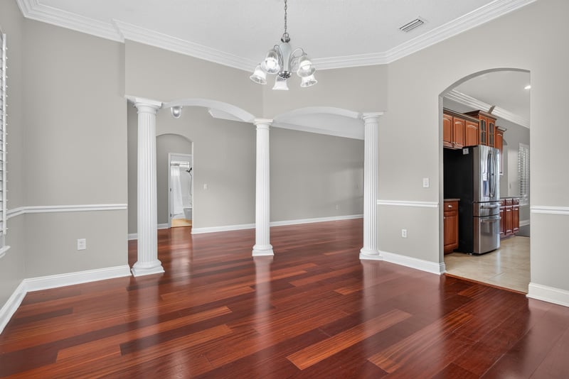Dining room view toward kitchen and columns at 4109 Eagle Landing Pkwy, Orange Park, FL 32065