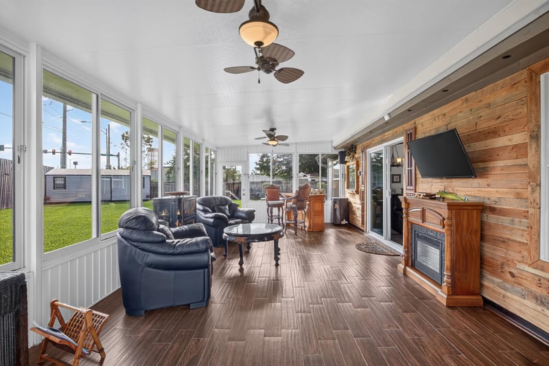 Sunroom with ceiling fans at 6931 Cane Grass Ln E, Jacksonville, FL 32244