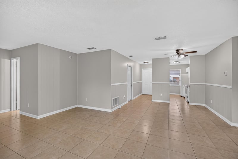 Open living and dining area with ceiling fan at 1040 Willow Cove Ct E, Jacksonville, FL 32233