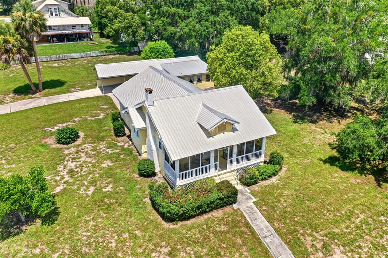 Drone rear view of roofline and lawn at 101 N Lake St, Crescent City, FL
