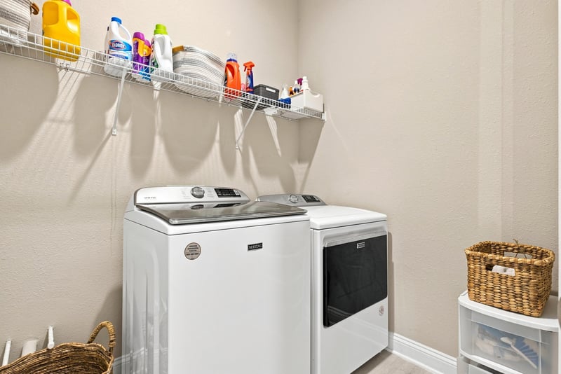 Laundry room with washer, dryer and shelving at 27 Holly Rdg Wy, St. Augustine, FL