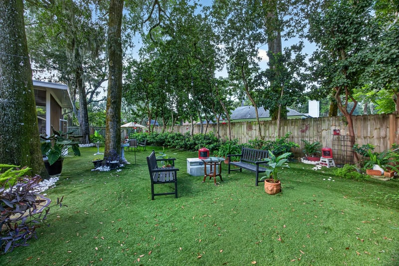 Backyard patio with chairs and landscaping at 1346 Gately Ct, Jacksonville, FL 32225