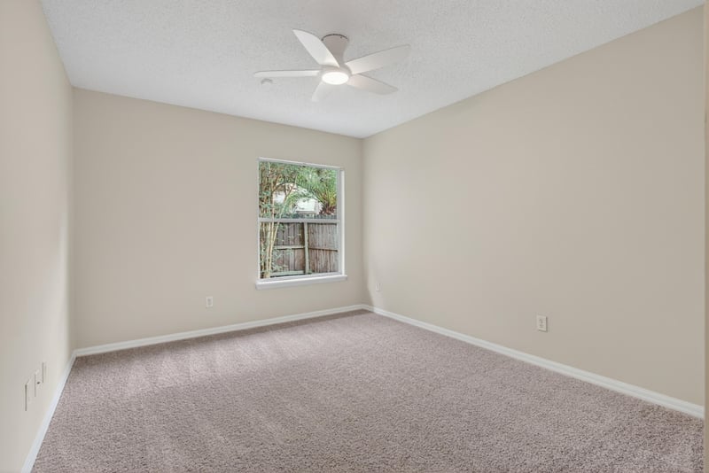 Bedroom with carpet, window and ceiling fan at 1648 Glen Laurel Dr, Middleburg, FL 32068