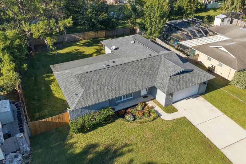 Drone aerial view of the home and street, photographed by Megapixeler on Crosby Ln, Orange Park