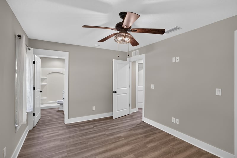 Hallway with doors and ceiling fan at 2855 N 8th St, St. Augustine, FL 32084