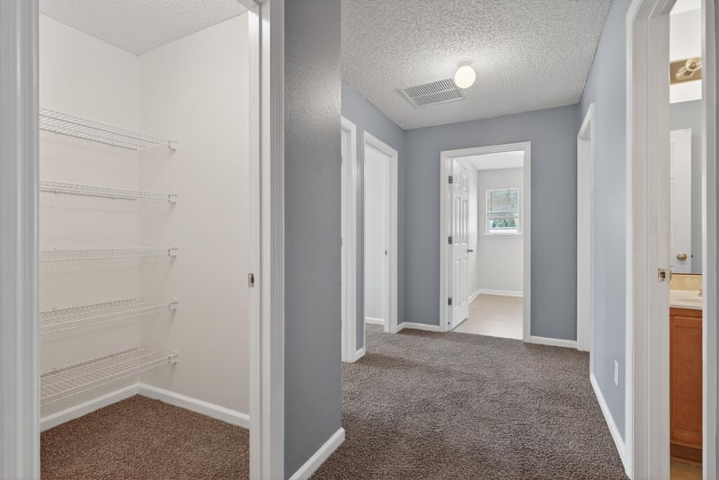 Hallway with Lining Closet at 2454 Britney Lakes Ln, Jacksonville, FL 32221