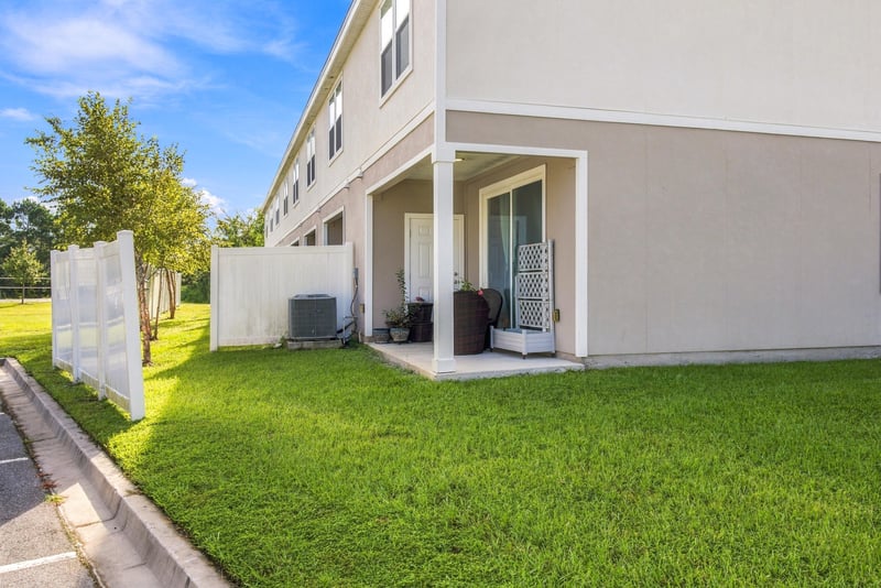Side exterior walkway with patio seating at 8359 Zenith Cir, Jacksonville, FL 32256