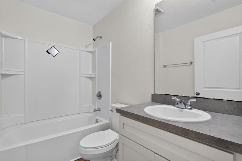 Bathroom with tub-shower and sink at 95221 Siena Ct, Fernandina Beach, FL 32034