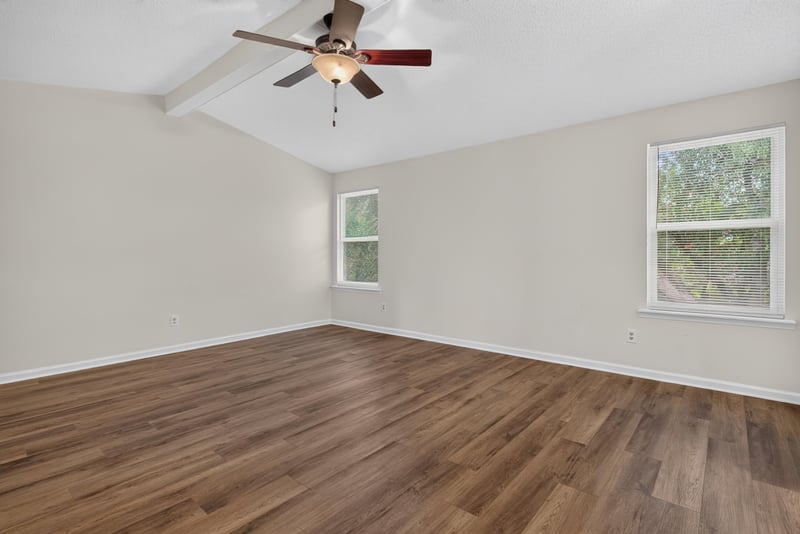 Empty room with vaulted ceiling and ceiling fan at 4427 Millstone Ct, Jacksonville, FL