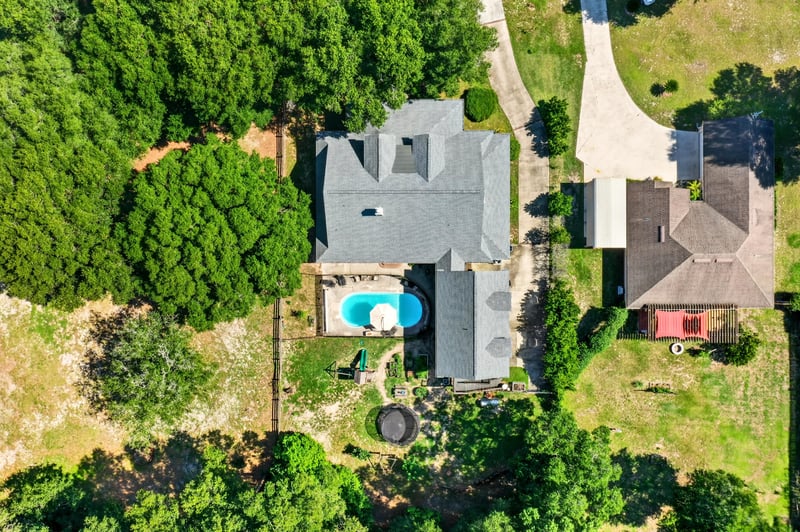 Aerial view of the home with pool and roofline at 1735 Hagans Ridge Ct