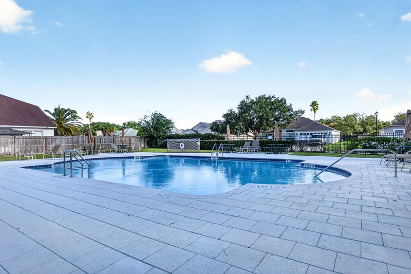 Community pool deck with lounge area in Johns Creek