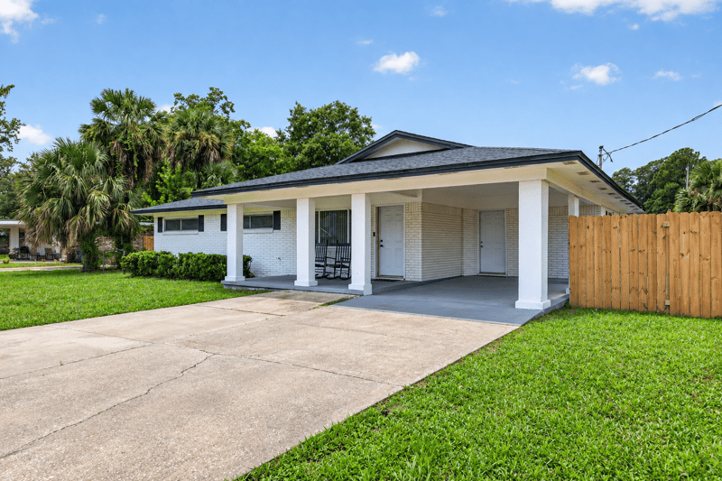 Carport and driveway view from the street at 9506 Harriet Ave, Jacksonville, FL 32208
