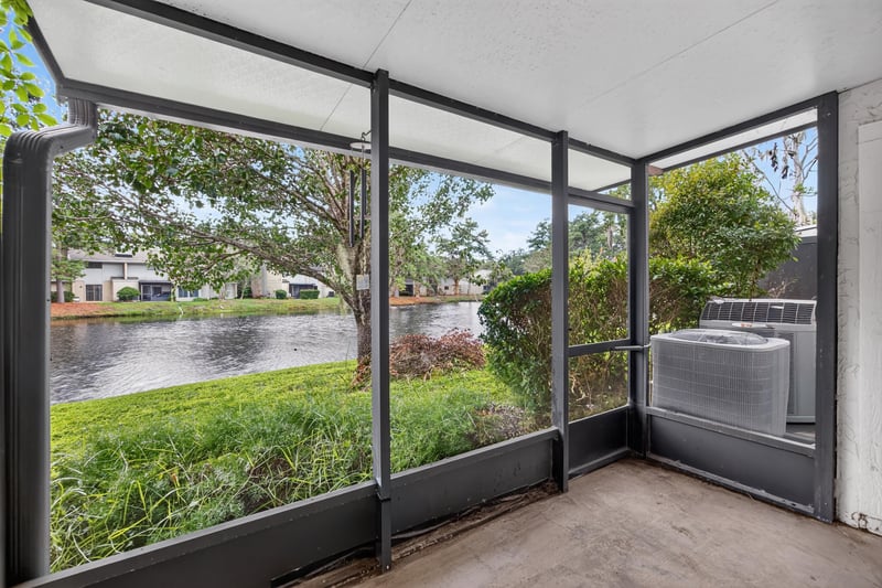 Screened porch with pond view at 3801 Crown Point Rd, Jacksonville, FL 32257