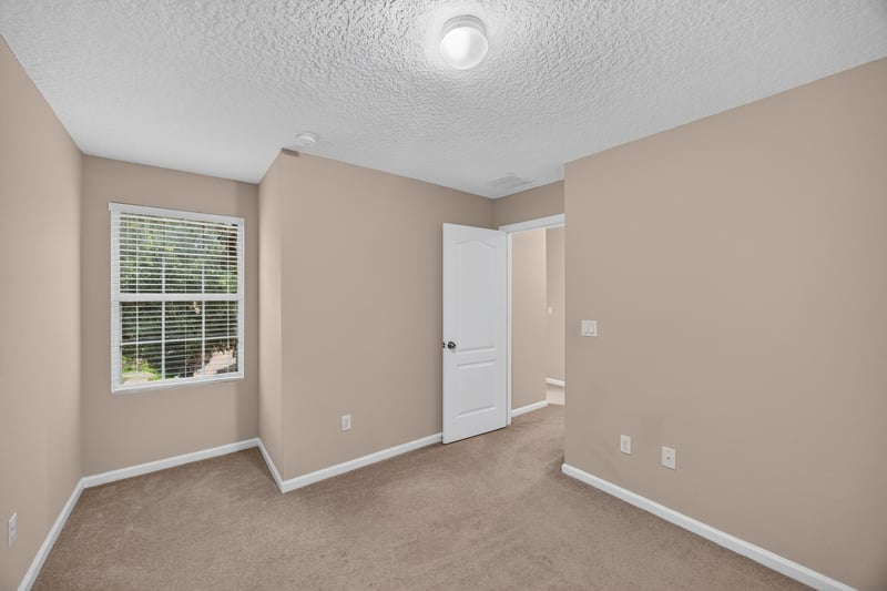 Bedroom with window and carpet at 3762 Hartsfield Forest Cir, Jacksonville, FL 32277