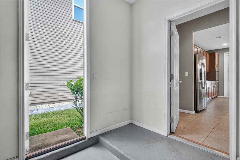 Back door and mudroom area with tile floor at 263 Gilmore Ln, Orange Park, FL 32065