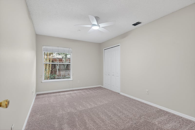 Bedroom with carpet and window at 1648 Glen Laurel Dr, Middleburg, FL 32068