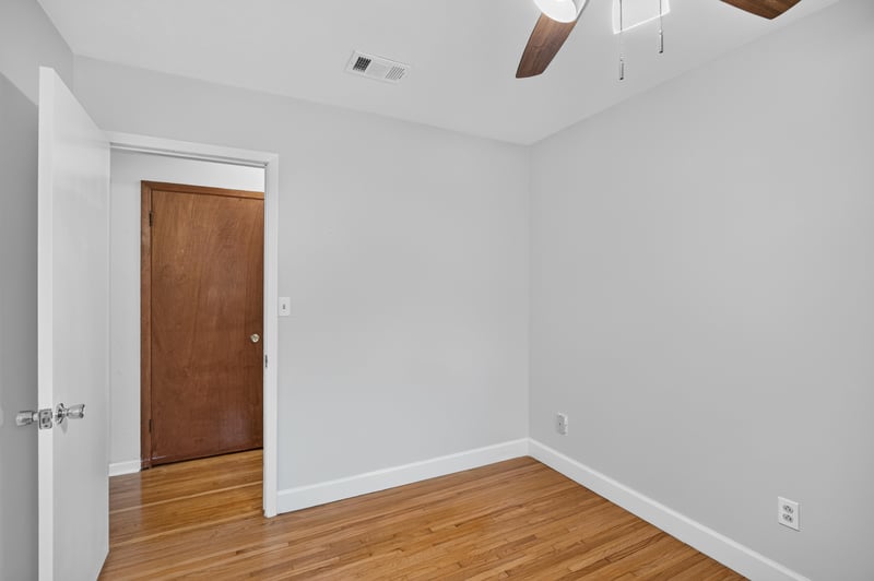 Hallway with wood door at 1847 Grove Park Dr, Orange Park, FL