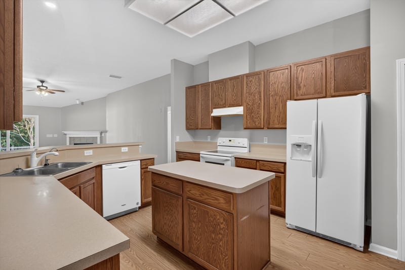 Kitchen with island and white appliances at 14147 Fish Eagle Dr E, Jacksonville, FL 32226