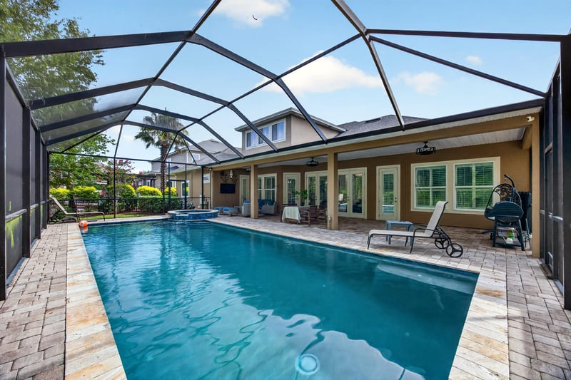 Screened pool with paver deck and lanai at 276 Cross Ridge Dr, Ponte Vedra Beach, FL 32081